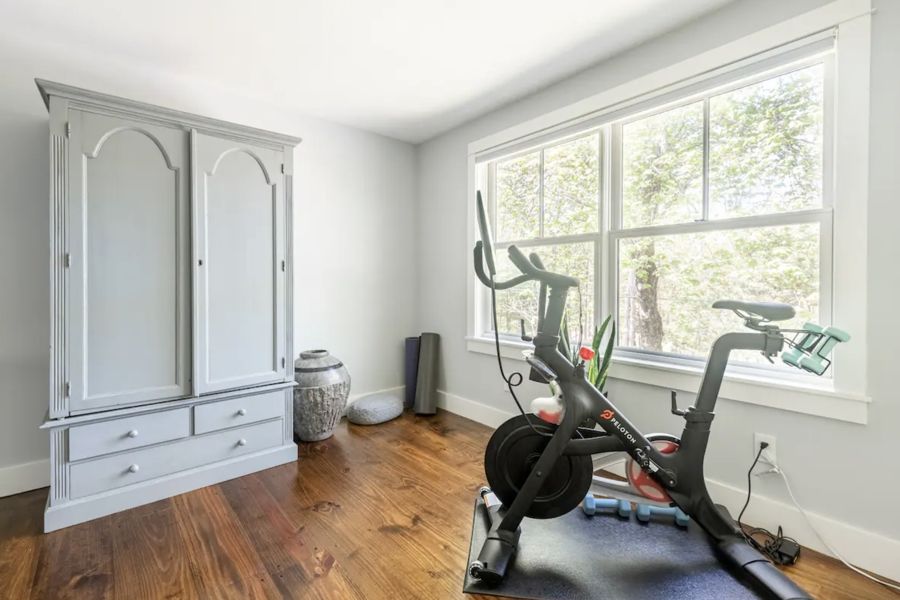 Peloton and armoire in Bedroom 1