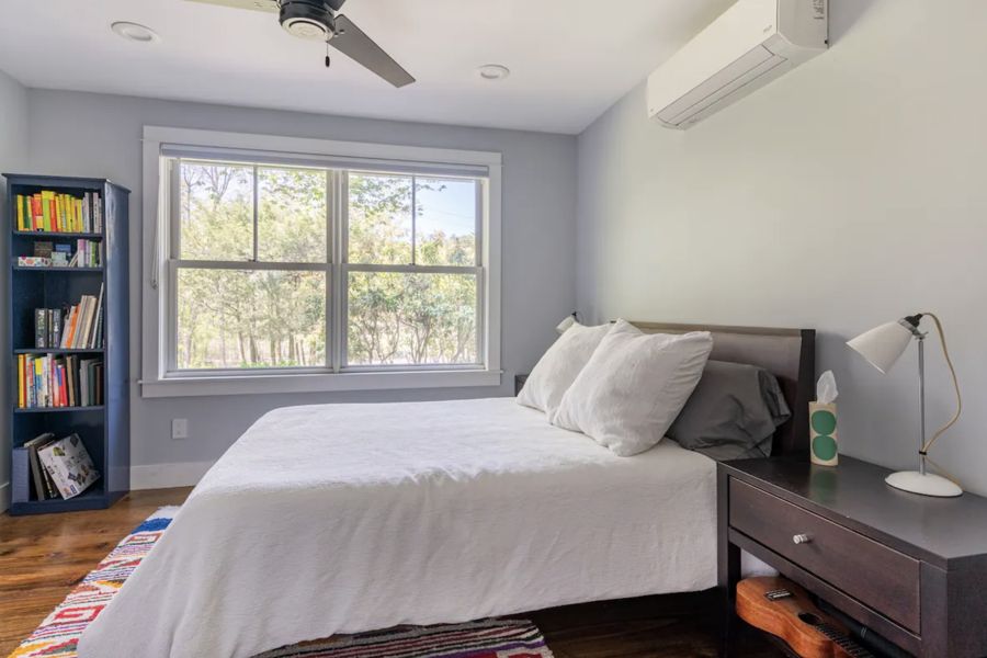 Bedroom 3 with double bed and bookshelf