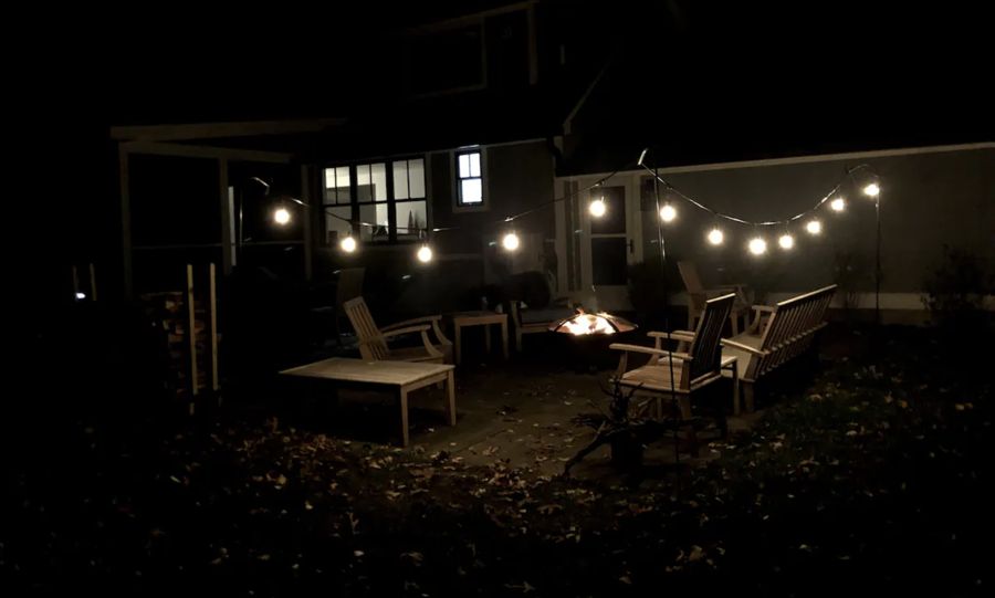 Fire pit and string lights at night