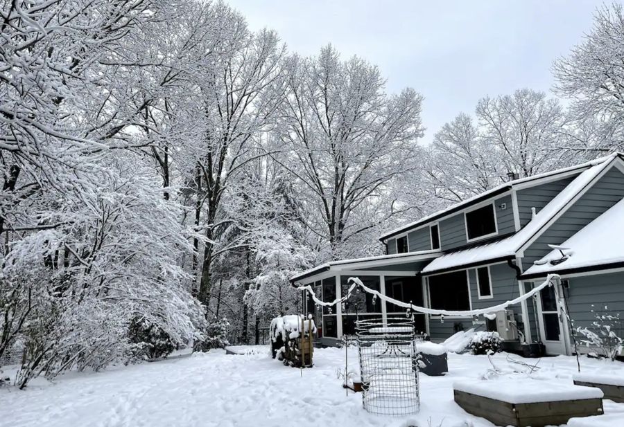 The house and yard under fresh snow